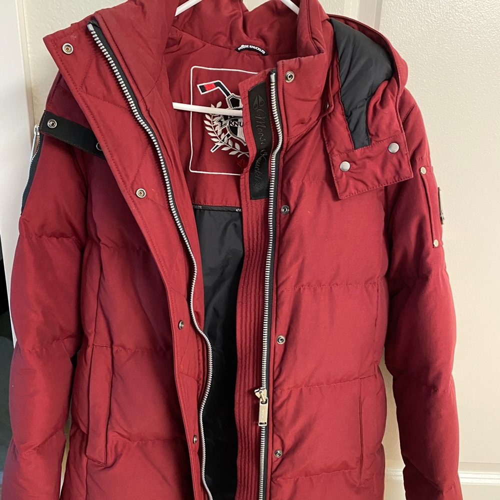 This lovely  moose knuckle coat was only worn once it is perfect for fall
